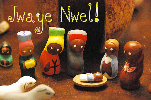 ZP_A toy Nativity scene with a coconut shell as the stable, from Haiti. Jwaye Noel means Merry Christmas in Haitian Creole._Jwaye Nwel dice Feliz Navidad en el idioma criollo haitiano.