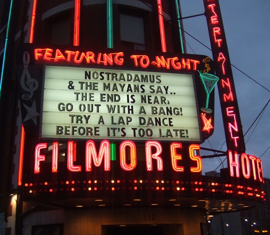 ZP_Dicen Nostradamus y los Mayas que Nos Acerca El Fin. Sal con un gran pum. Disfrútate con un baile erótico del regazo, antes de que esté demasiado tarde…Sunset, December 20th 2012_Marquee of a Striptease Tavern in Toronto, Canada_A light touch concerning the gravitas of 21.12.2012 !