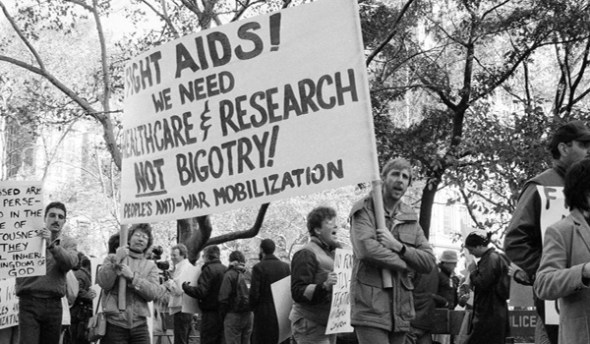 "Fight AIDS! We need healthcare and research, not bigotry!." A 1985 demonstration in front of New York City Hall as a City Council committee considered legislation to bar pupils and teachers with the AIDS virus from public schools_photograph by Rick Maiman_By the end of 1981, 159 cases of the mysterious new disease had been reported in the USA.  By 1985, 15,527 cases of AIDS had been reported, with 12,529 deaths.  Ten years later, in 1995, it was 513,486 cases and 319,849 deaths, making AIDS the leading cause of death for Americans ages 25 to 44.