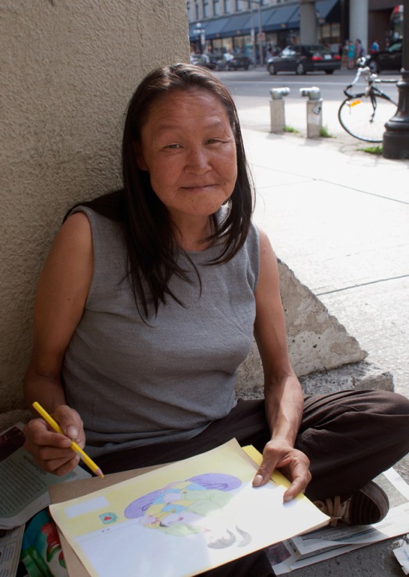 Annie Pootoogook outside the Rideau Centre in Ottawa making a drawing with coloured pencils_Summer of 2012