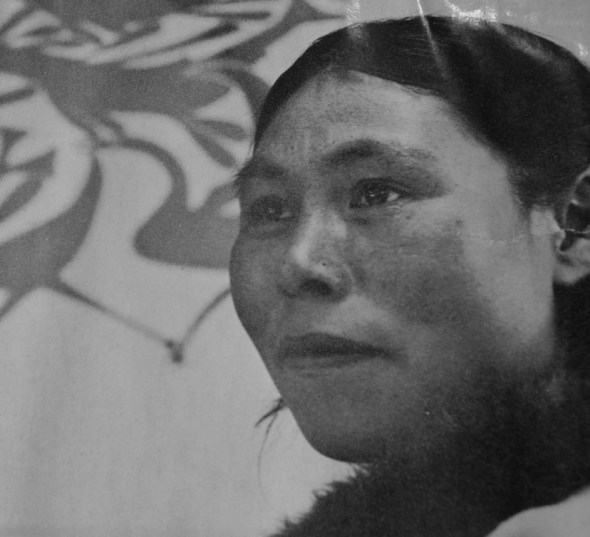 Kenojuak photographed in 1963 in front of one of her prints