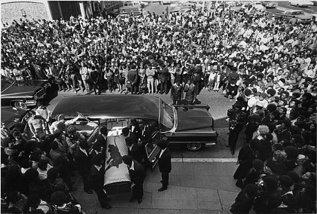 Crowd outside in Oakland, California, when  George Jackson's coffin was being brought into St. Augustine's Church_photograph by Stephen Shames_August 1971