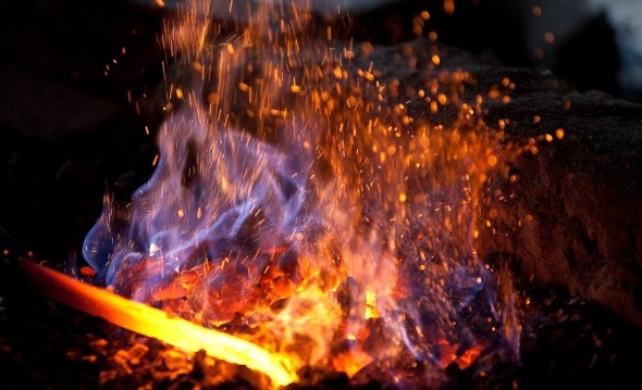 A blacksmith's forge with an iron in the fire_photograph copyright Sergey Dolya
