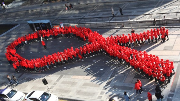 World AIDS Day 2013_highschool students in Seoul South Korea form themselves into the red ribbon universal symbol of AIDS Awareness_December 1st 2013