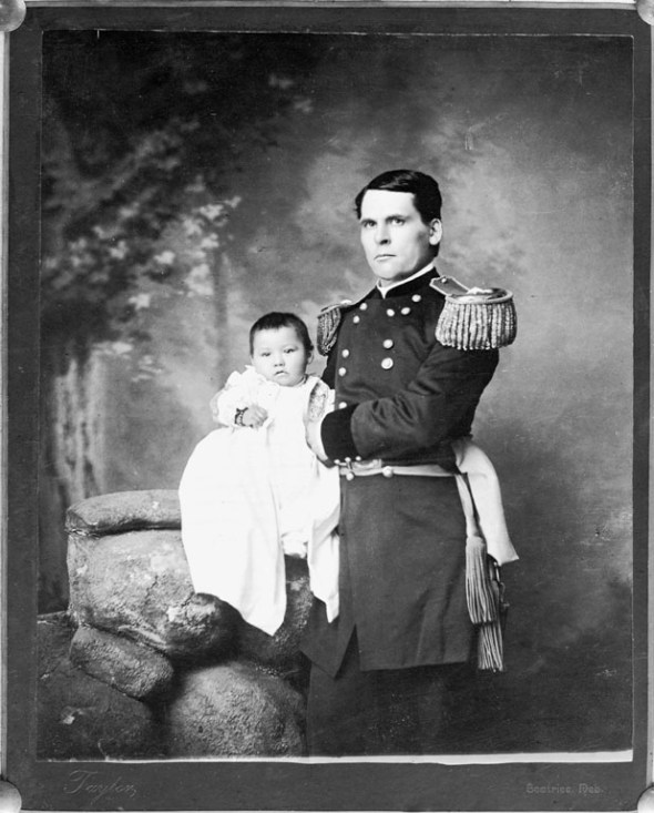 1891 Portrait of General L.W. Colby of Nebraska State Troops, holding baby girl Zintkala Nuni (Little Lost Bird), found on the Wounded Knee battlefield_This photograph is part of the long official history of the sentimentalization of Native genocide in the U.S.A.