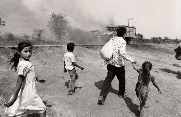 John Hoagland_photograph from the early 1980s in Usulután El Salvador_Civilians fleeing...